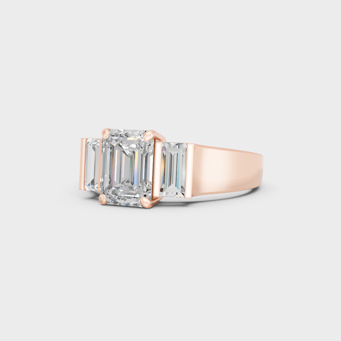 Distinctive 2.2 Carat Emerald and Baguette-Cut Lab-Grown Diamond Three-Stone Ring in 18K Rose Gold.